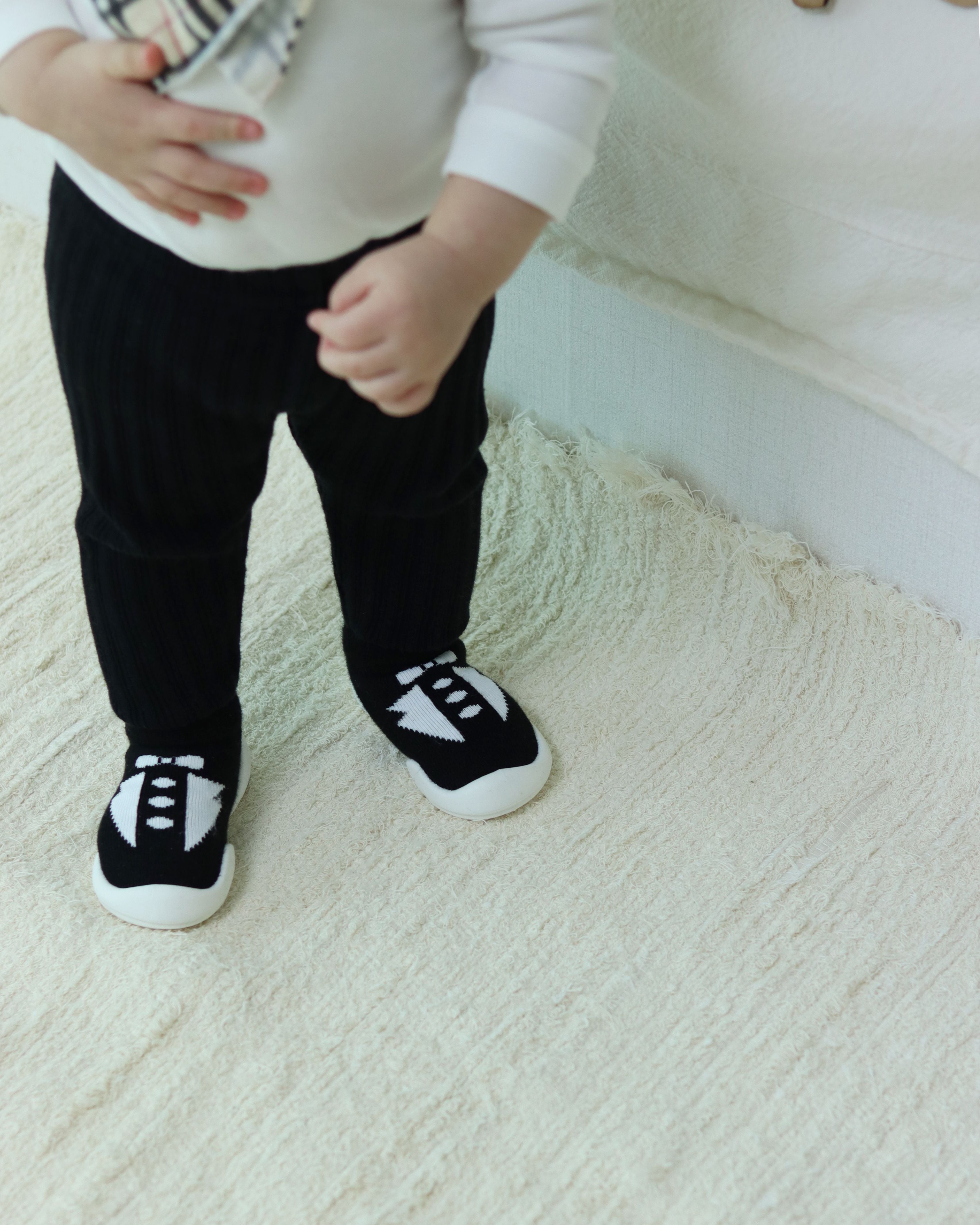 Tuxedo Baby First Walking Shoes: Elastic baby shoes with honeycomb outsole for slip resistance. Gentle flex for delicate baby foot cartilage, lightweight design for growth and learning to walk.